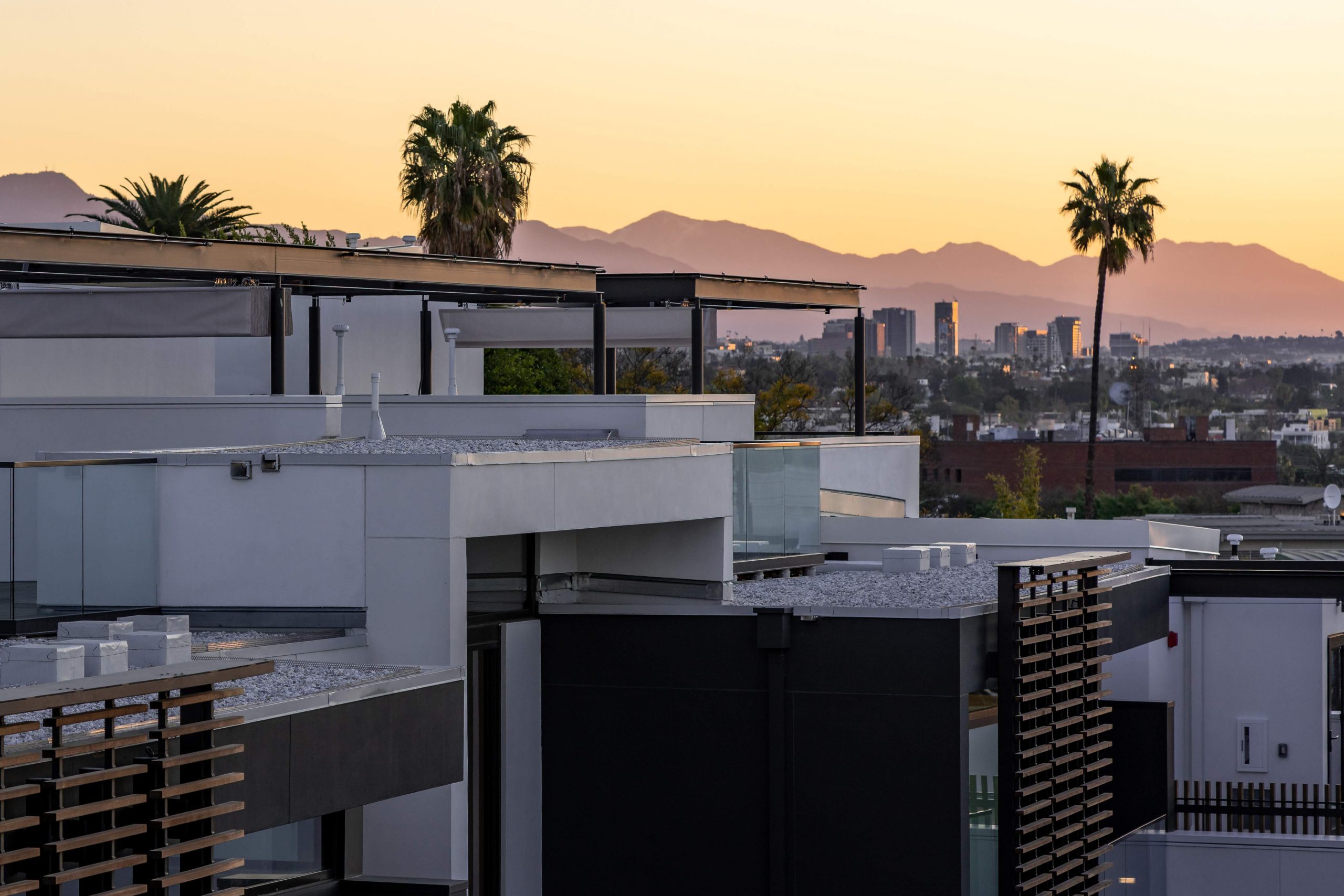 View over the roofs of luxury apartments. Hollywood Hills in the background.