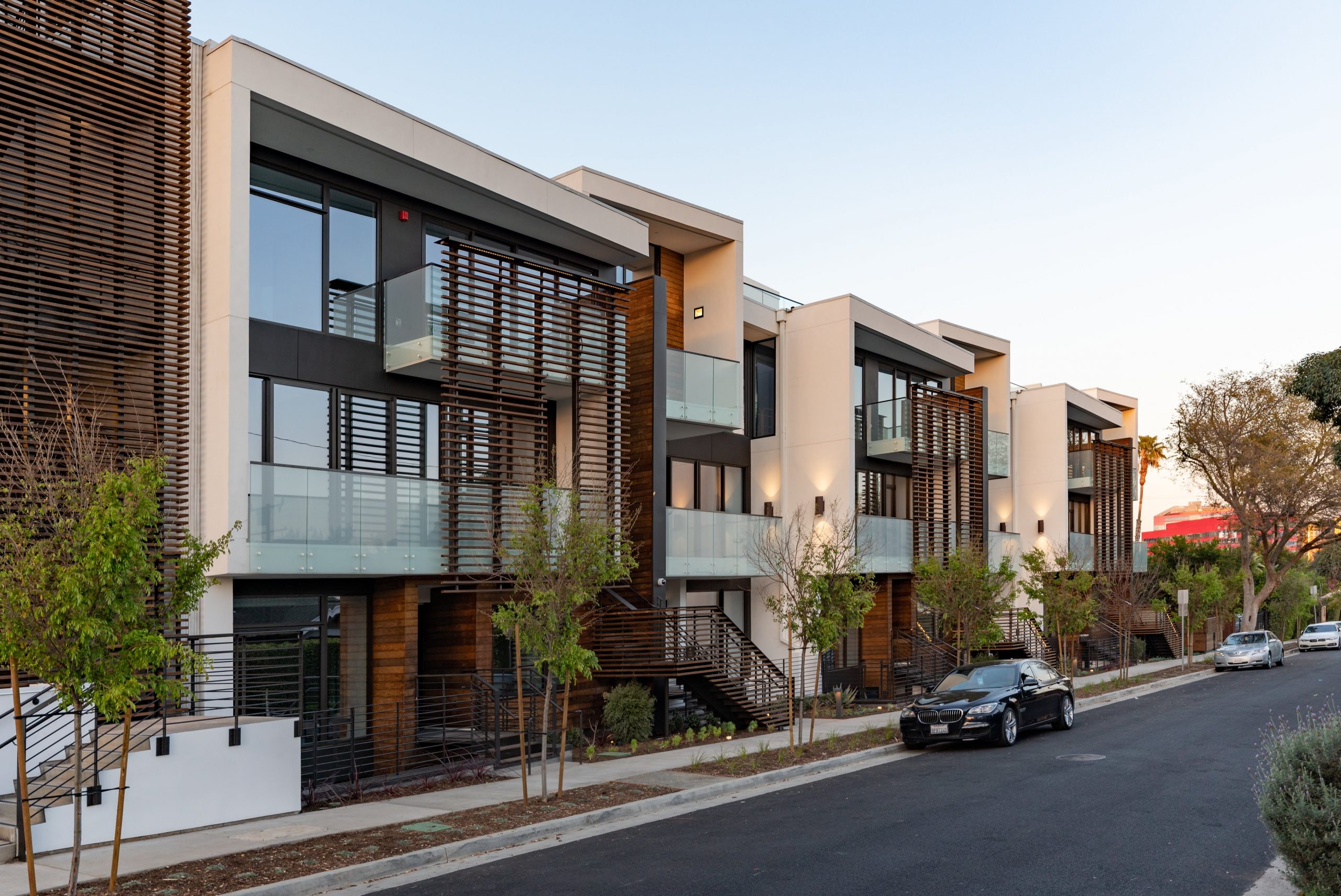 Modern luxury front street condominiums with wood details.