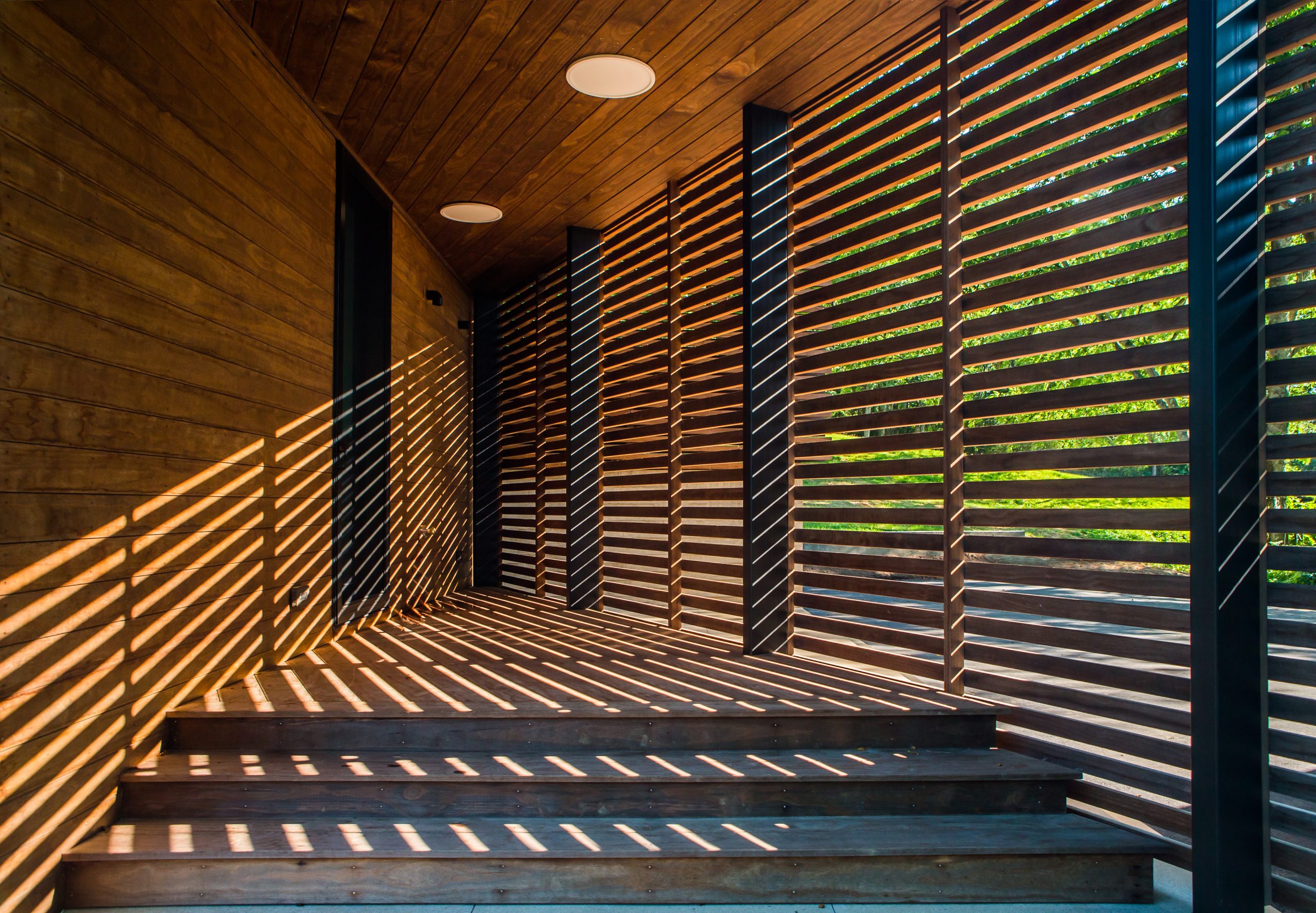 Entrance with wooden slats.