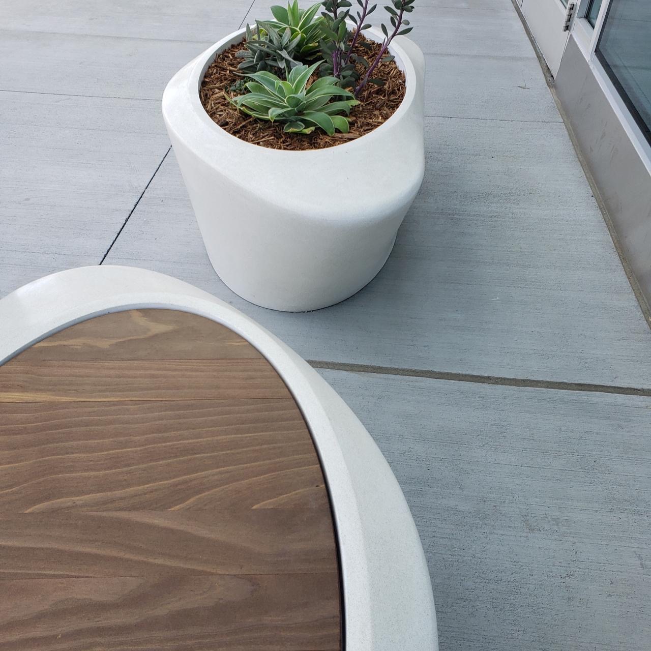 Chair and planter in white with wood.