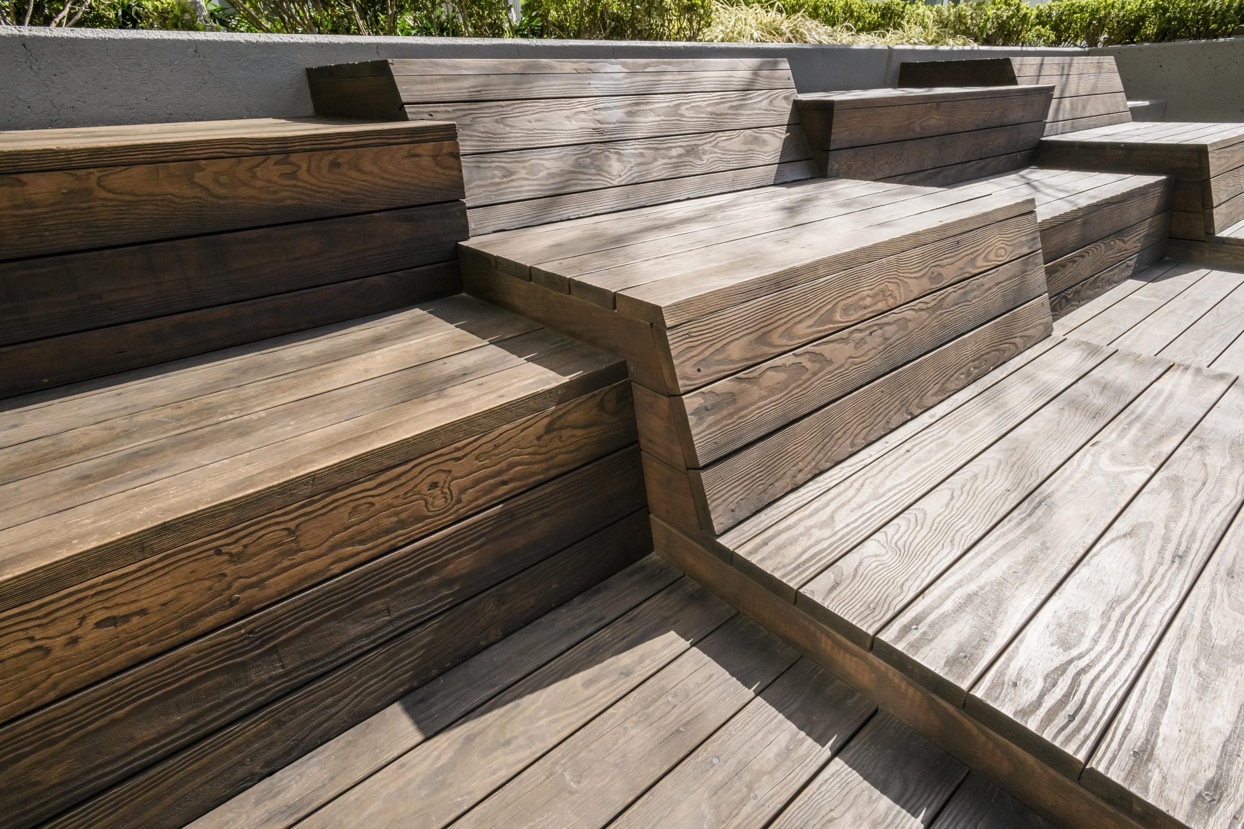 Outside seating area and benches with Kebony© wood.
